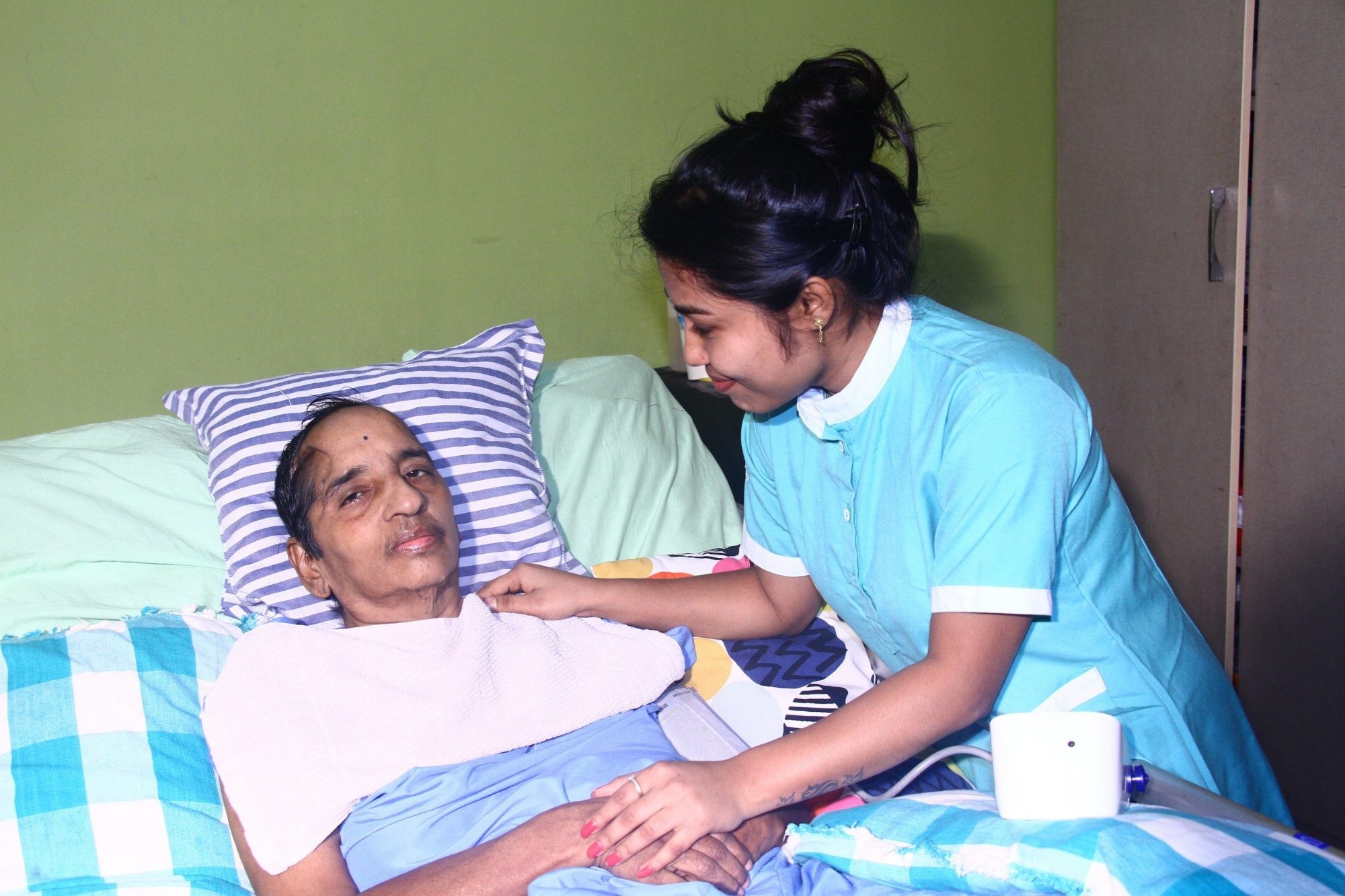 Professional caretaker providing compassionate home care services in Dehradun for elderly and patients